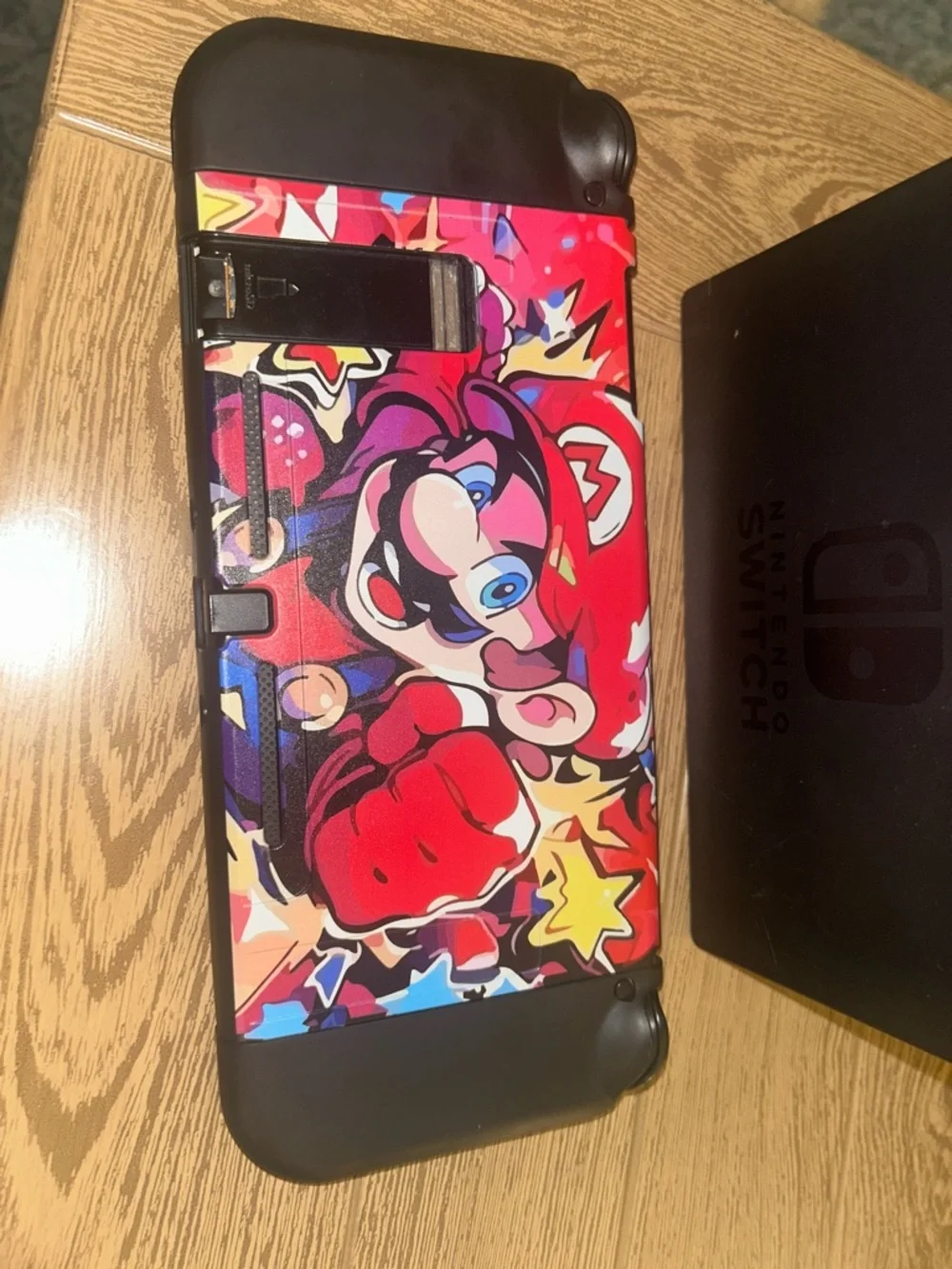 Nintendo Switch with Red, Blue, Black Graphic Controller Wraps